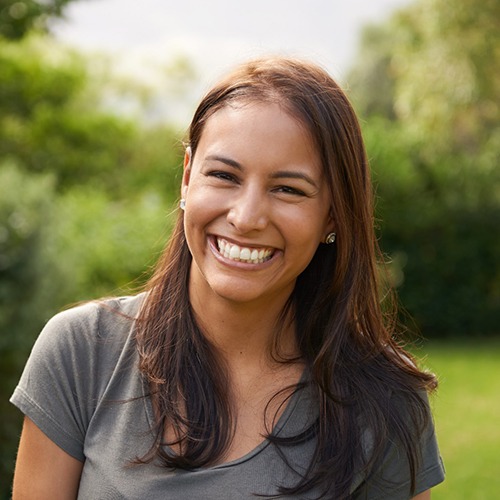 Woman outside with dental implants in Flower Mound, TX