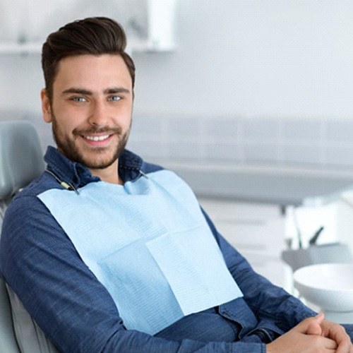 a patient smiling after scaling and root planing