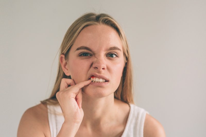 Woman with gum irritation